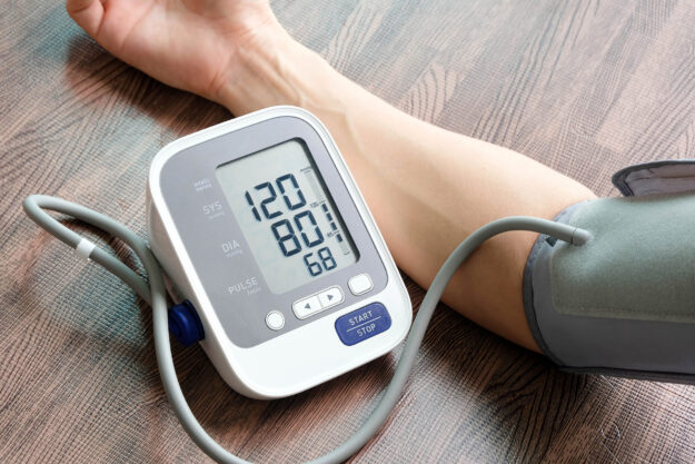 Doctor woman check blood pressure monitor and heart rate monitor pressure gauge Health care and Medical concept