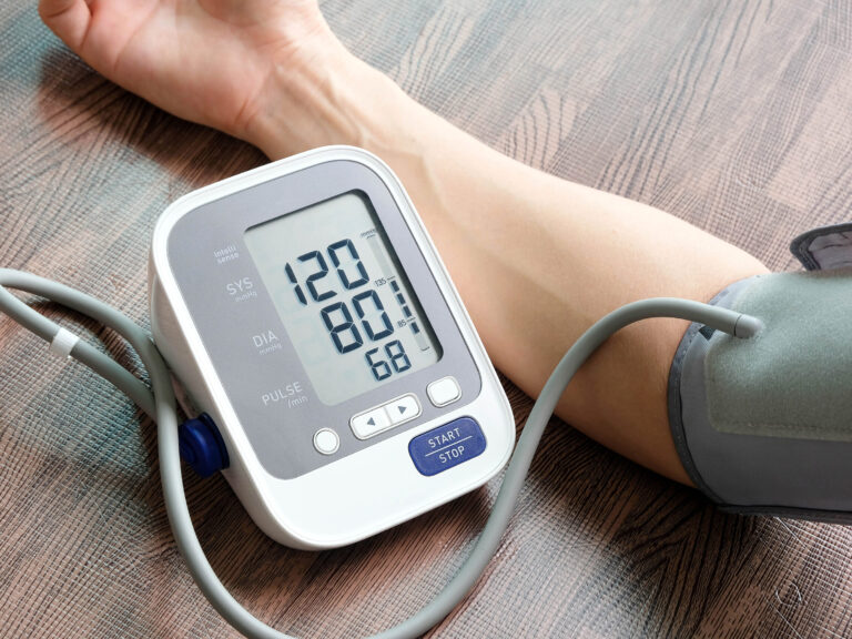 Doctor woman check blood pressure monitor and heart rate monitor pressure gauge Health care and Medical concept