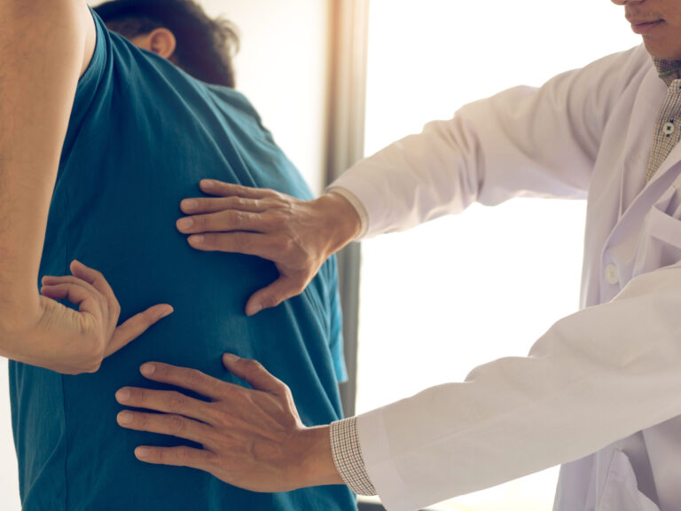 Patient is pointing to the point where the muscle pain is provid