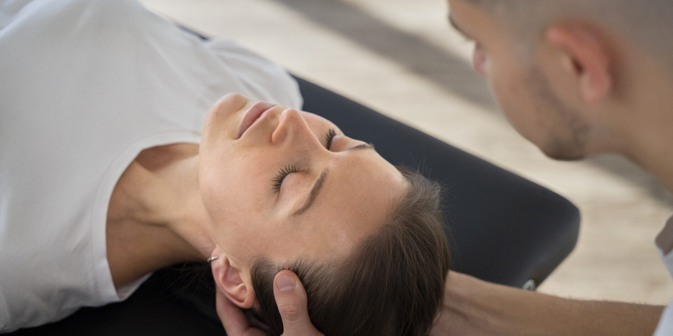 close-up-therapist-holding-patient-s-head