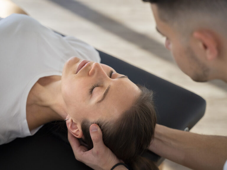 close-up-therapist-holding-patient-s-head